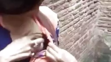 Adorable Desi cutie flashes curious friend her XXX tits in public