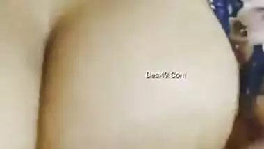 Desi woman in floral robe teases lover demonstrating big breasts